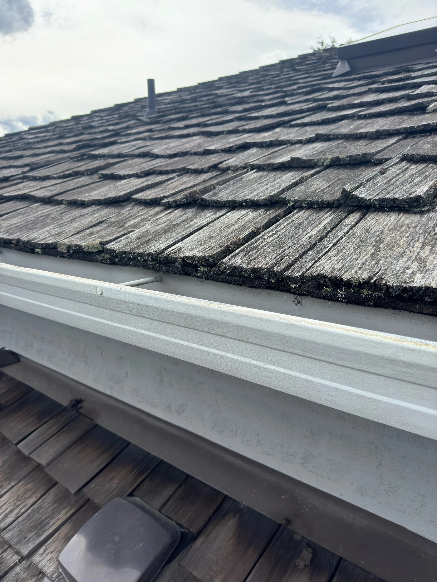 Same gutter face brightened white after exterior gutter cleaning