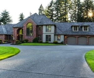 Same driveway fully restored to even gray concrete, dramatically lifting the home's curb appeal