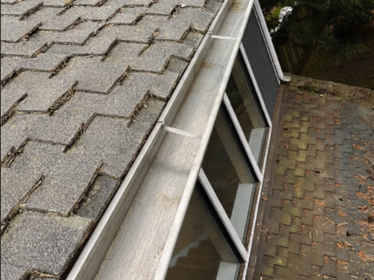 Repaired and re-secured gutter line after service
