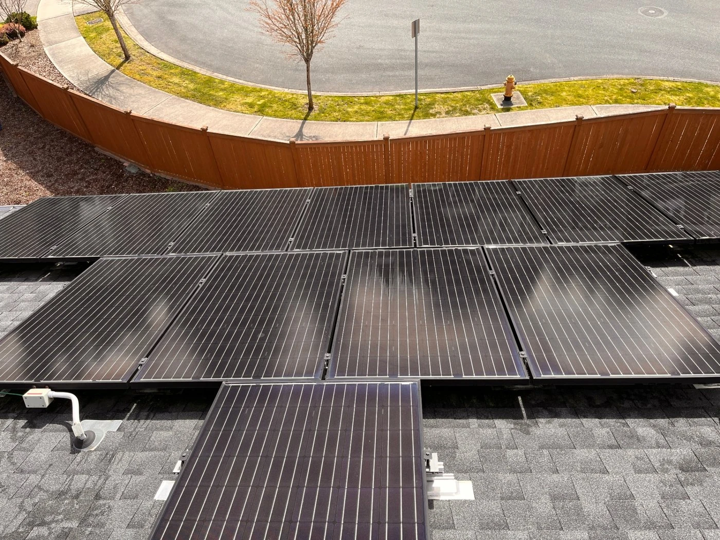 Same solar array fully cleaned and restored to deep-black reflective finish